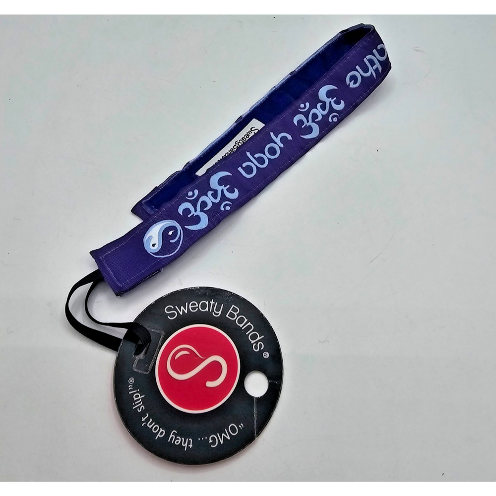 purple Sweaty Bands non-slip headband featuring white Om symbols and yin-yang